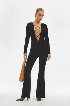SOLADO Plunging Neck Lace Up Long Sleeve Flared Jumpsuit